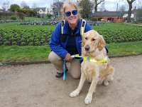 Tracey and Guide Dog Teddy shortly after qualifying, photographed in Caldicott Park, Rugby.
